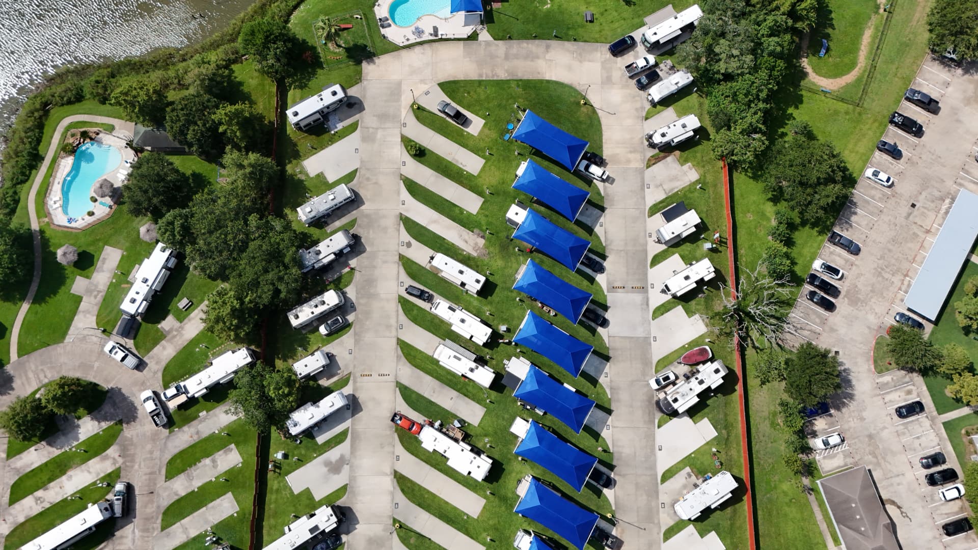 Aerial view of the pool and shaded RV sites at Brickhouse RV Resort on Jarboe Bayou