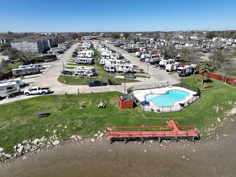 Aerial view of the Brickhouse RV Resort pool and fishing pier on Jarboe Bayou