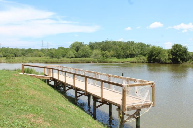 Wooden fishing pier over Jarboe Bayou